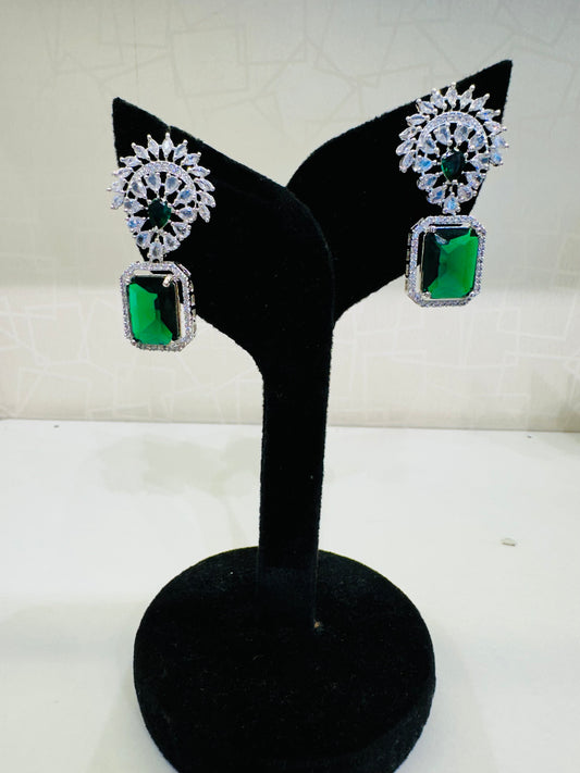 Side angle of HeyBae AD Stud Drop Stone Earrings with polished finish