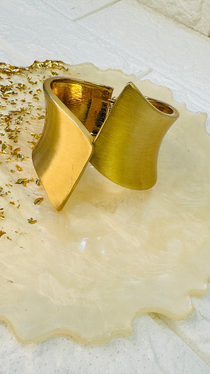 Geometric gold cuff bracelet displayed in HeyBae premium gift jewelry