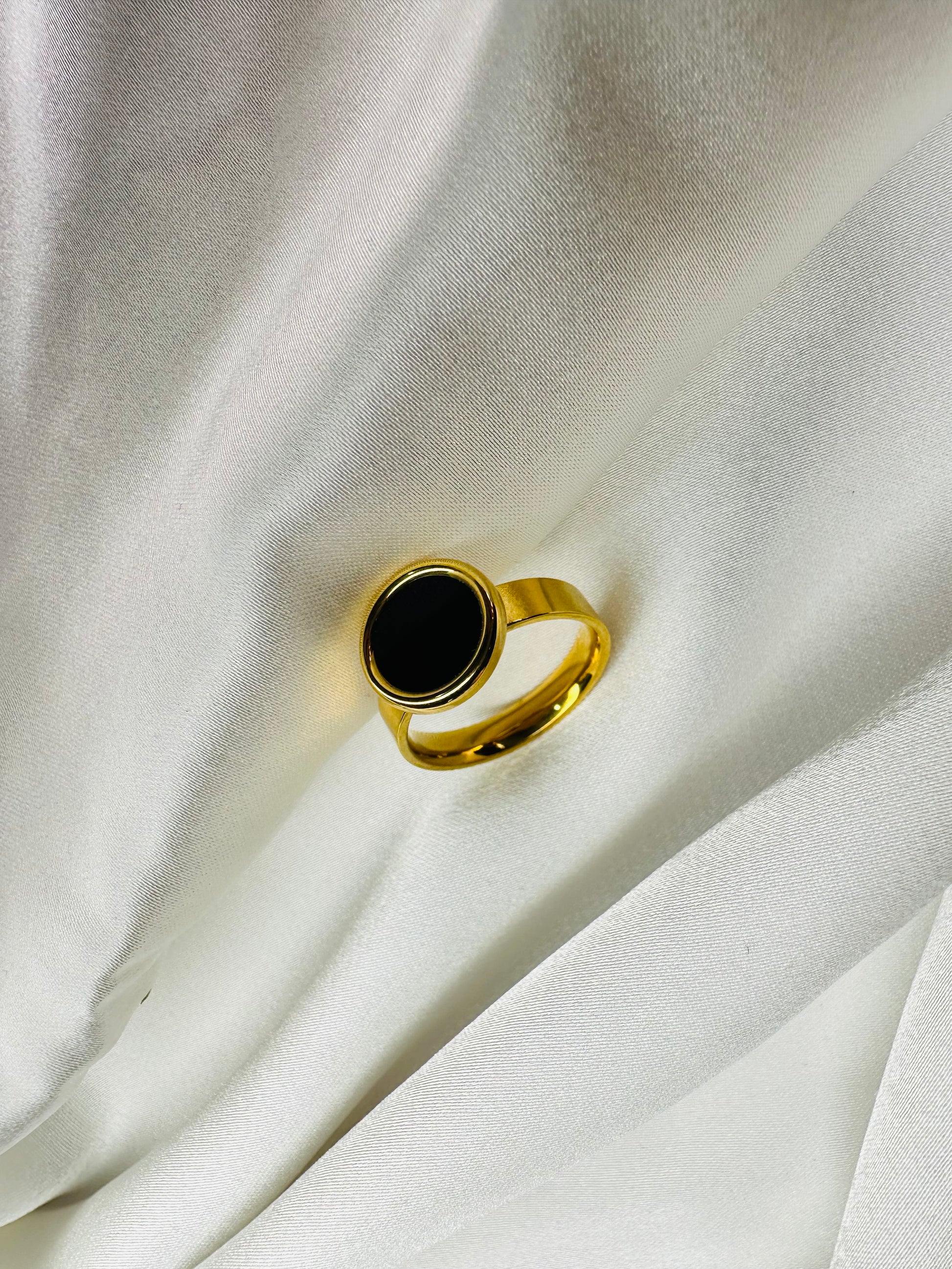 HeyBae gold black stone ring on hand – stylish stainless steel women’s ring