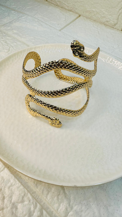Gold snake cuff bracelet – front view with coiled serpent design