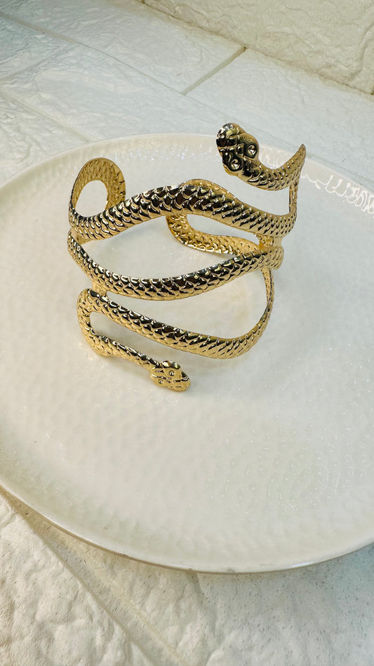 Gold snake cuff bracelet – front view with coiled serpent design