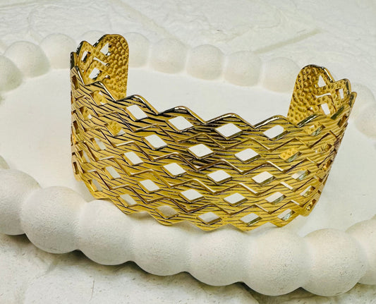 Open lattice gold cuff bracelet with geometric cut-out design