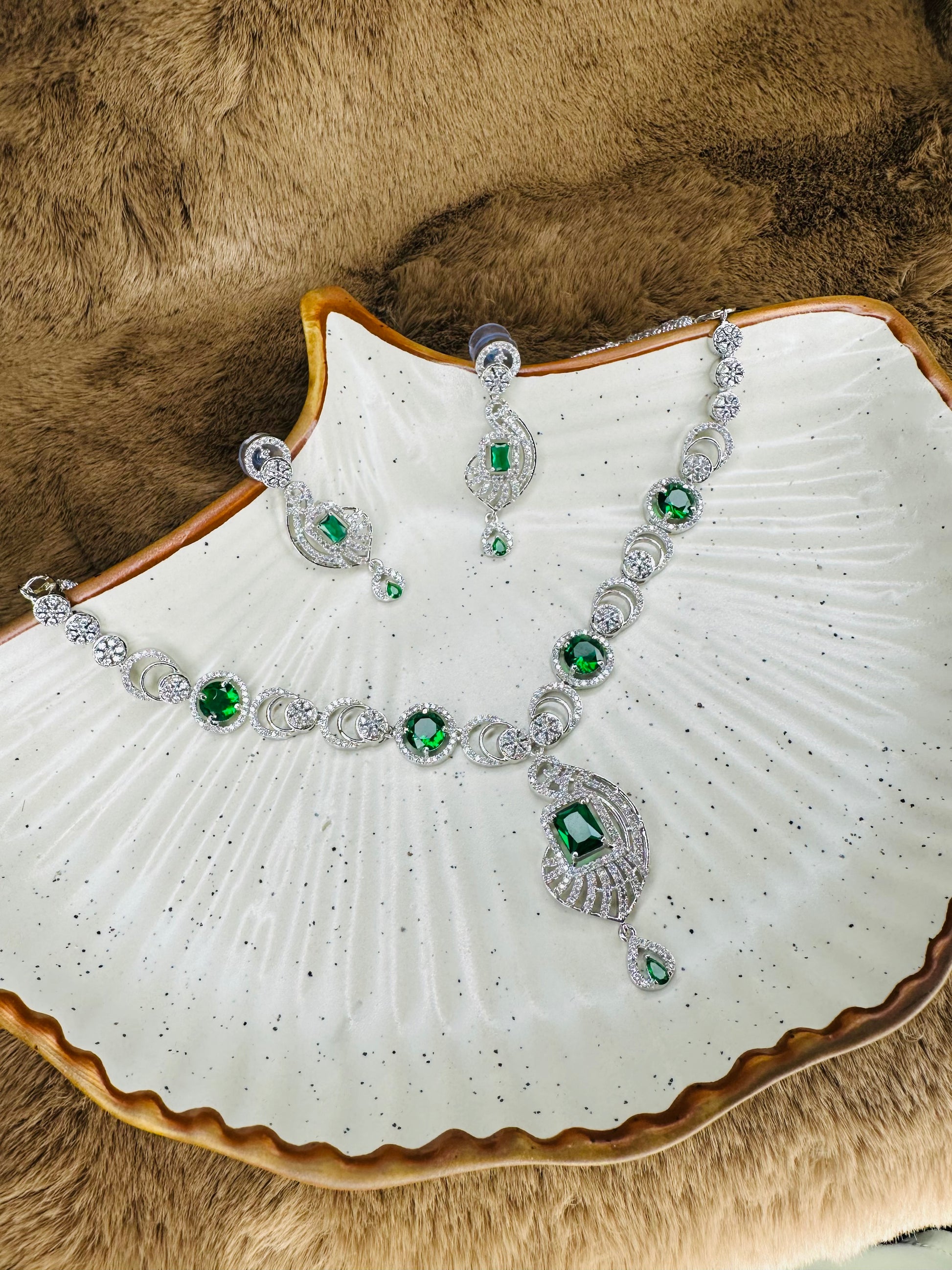 Side View of HeyBae Sapphire Blue and Emerald Green Necklace & Earrings