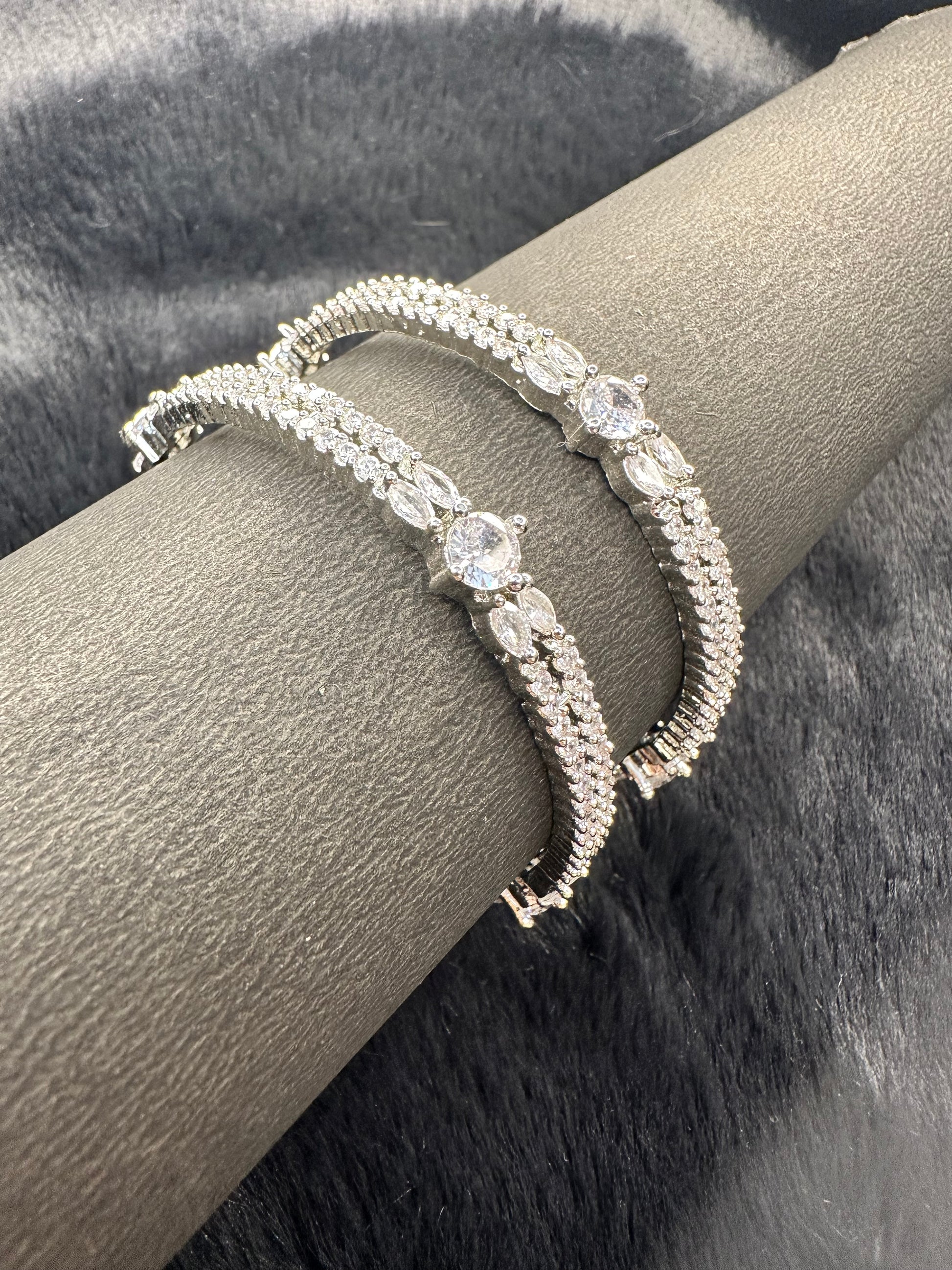 Detailed carvings and stones on HeyBae silver bangle