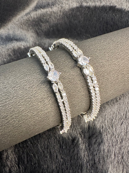 tack of HeyBae silver and gold bangles