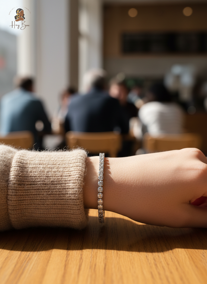 Close-up of a hand wearing a bracelet with a blurred indoor setting in the background