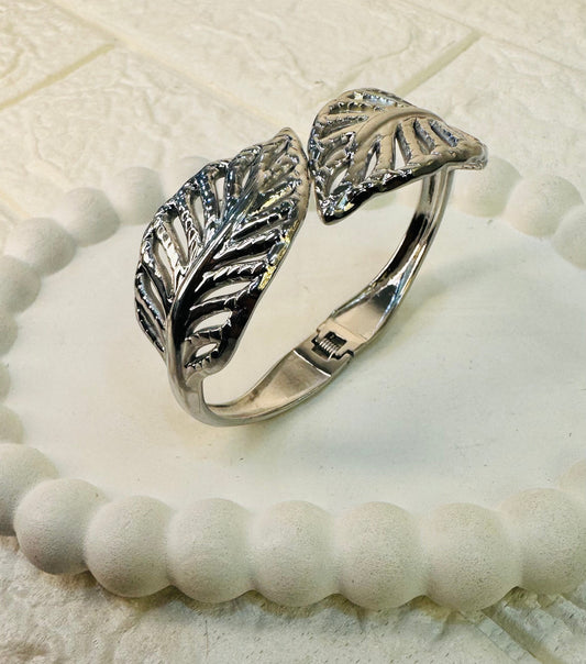 Silver leaf motif cuff bracelet with hinged clasp