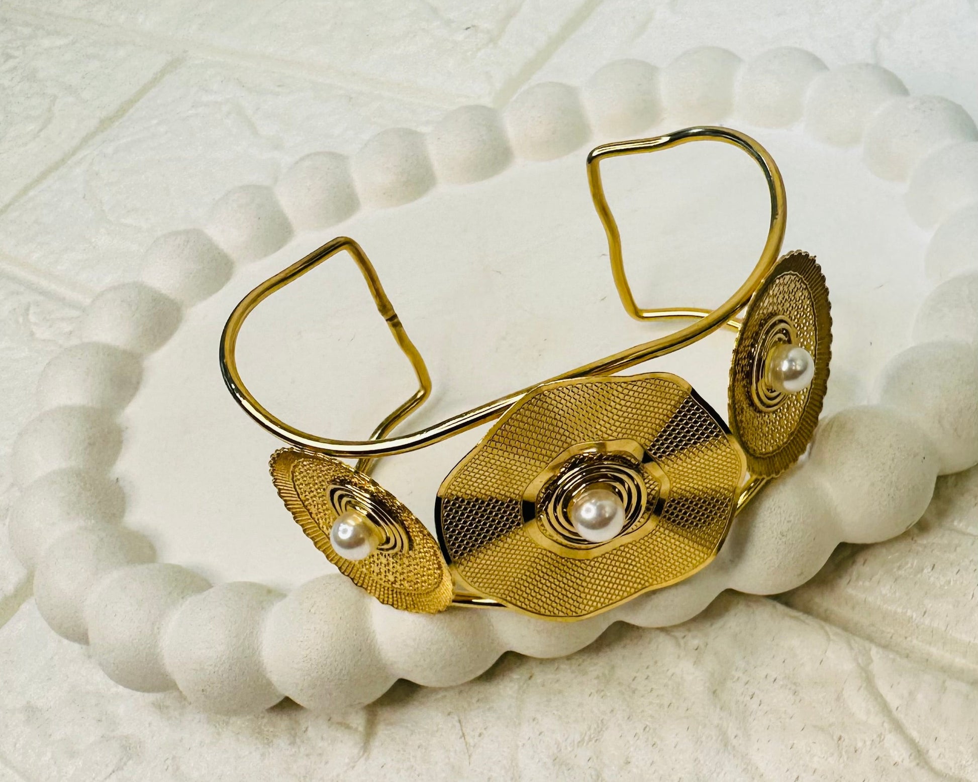 Adjustable gold kada bracelet with triple disc pearl centerpiece