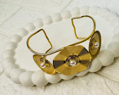 Adjustable gold kada bracelet with triple disc pearl centerpiece