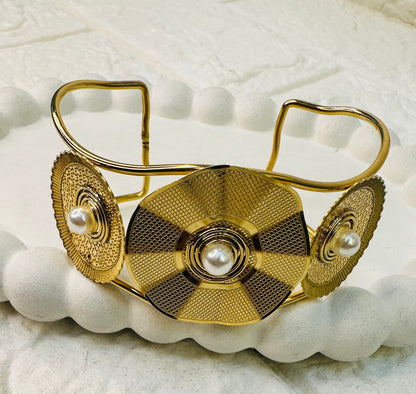Festive statement cuff bracelet with gold and pearl accents